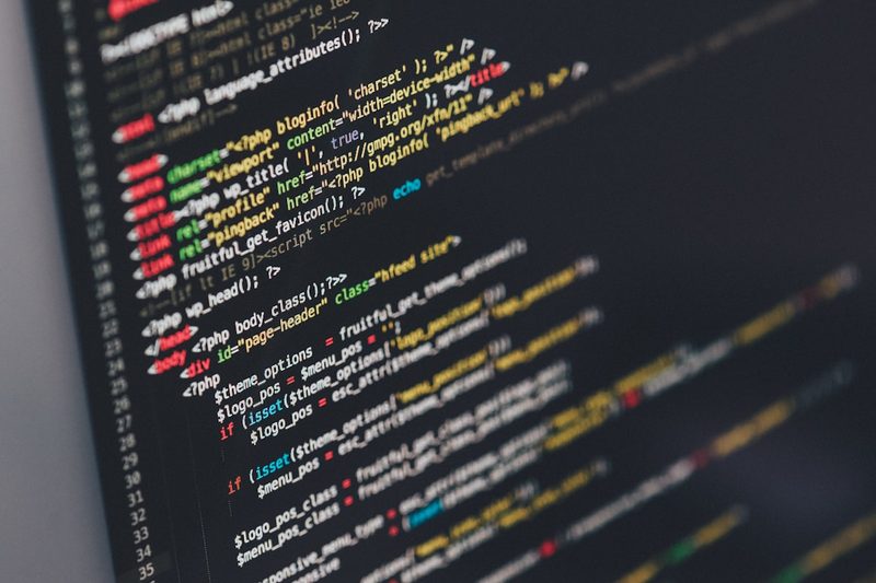 Syntax-highlighted HTML and PHP source code on a dark editor background